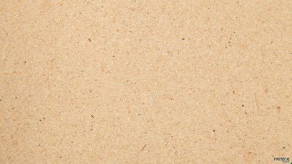 Spånskiva med beige och små bruna prickar.