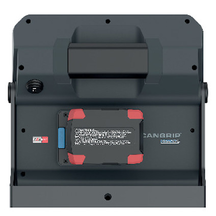 En svart elektronisk enhet med etiketter på engelska och spanska. Finns också en av/på-switch och text "CAN GRIP CONNECT".